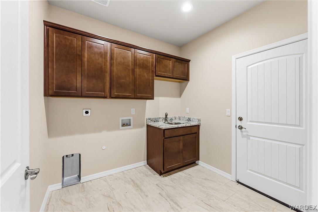 9818 North Cyrus Road Kingman, AZ 86401 - Photo 27 of 42 a view of kitchen with stainless steel appliances granite countertop cabinets and wooden floor
