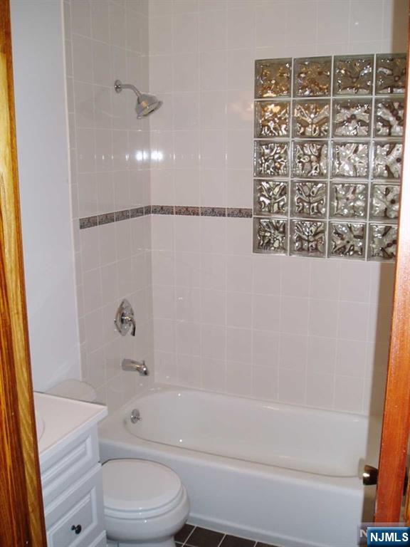 71-73 Bloomfield Avenue, Unit 71LEFT SIDE River Edge, NJ 07661 - Photo 6 of 7 a bathroom with a toilet and a bathtub