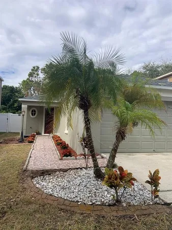 a view of a house with a yard