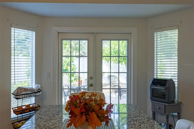 an aerial view of house with yard swimming pool and outdoor seating