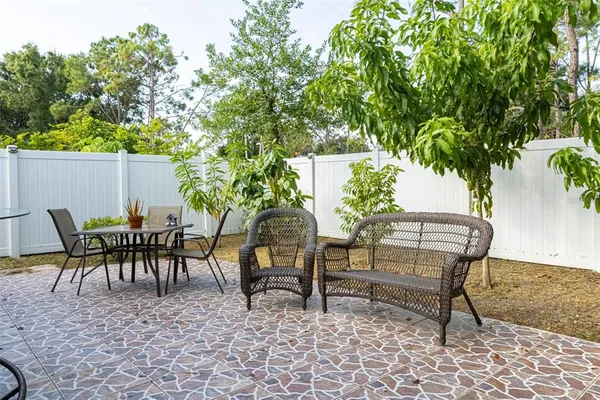 swimming pool with a bench and some trees