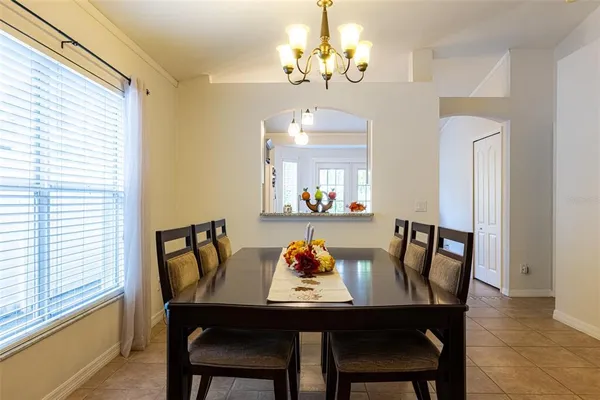 a view of a dining room with furniture window and outside view