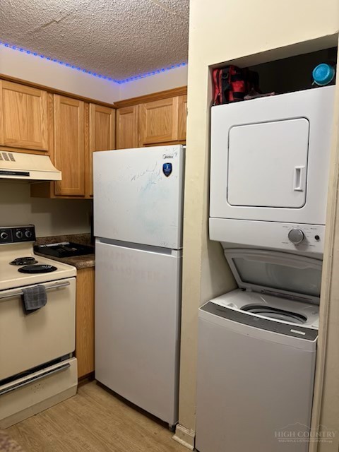 229 East King Street, Unit 31 Boone, NC 28607 - Photo 10 of 26 a white refrigerator freezer and a stove sitting inside of a kitchen