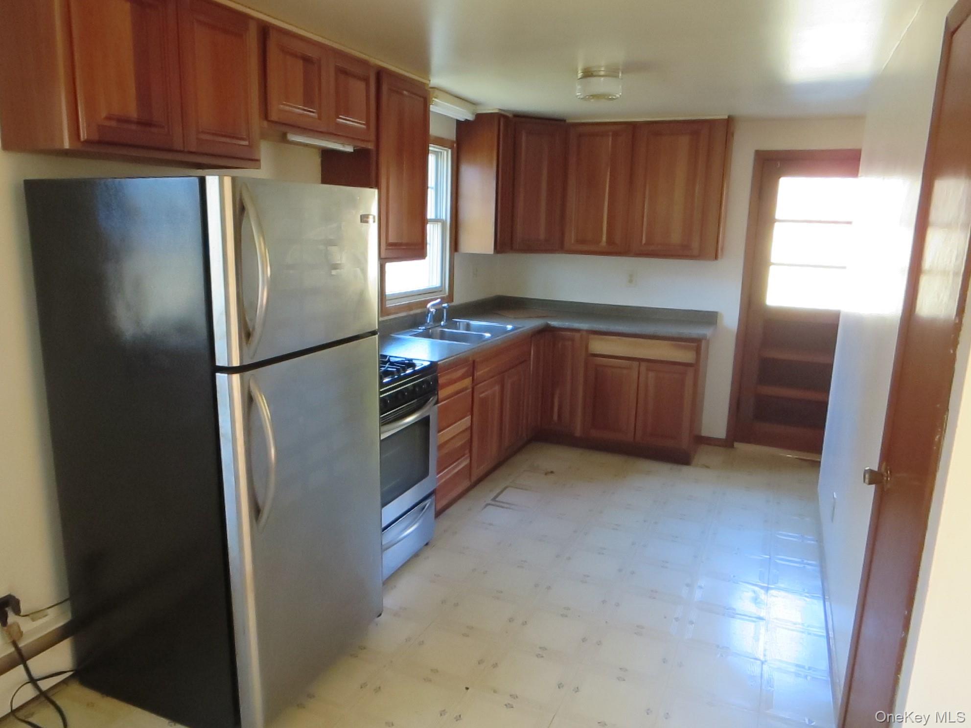 3057 Pleasant Ridge Road Wingdale, NY 12594 - Photo 7 of 13 a kitchen with stainless steel appliances granite countertop a refrigerator and a stove top oven