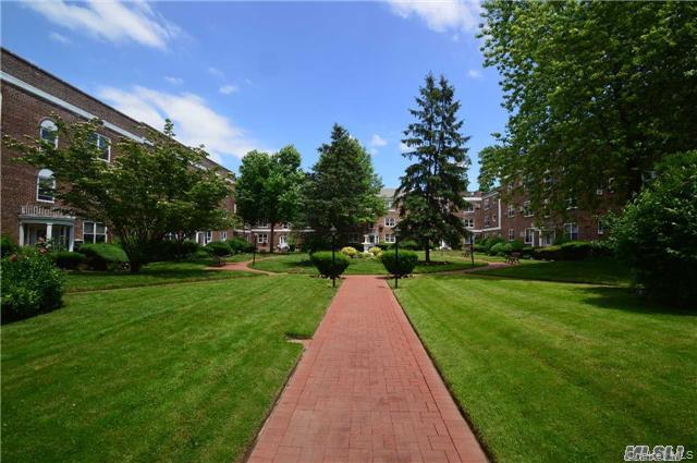 221 Middle Neck Road, Unit G5 Great Neck, NY 11021 - Photo 2 of 3 Surrounding community with a lawn