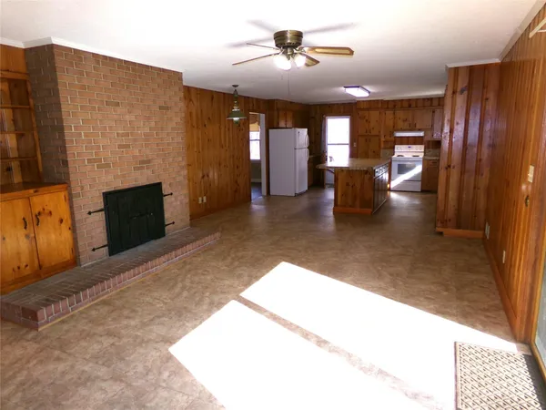 a lobby with furniture and a fireplace