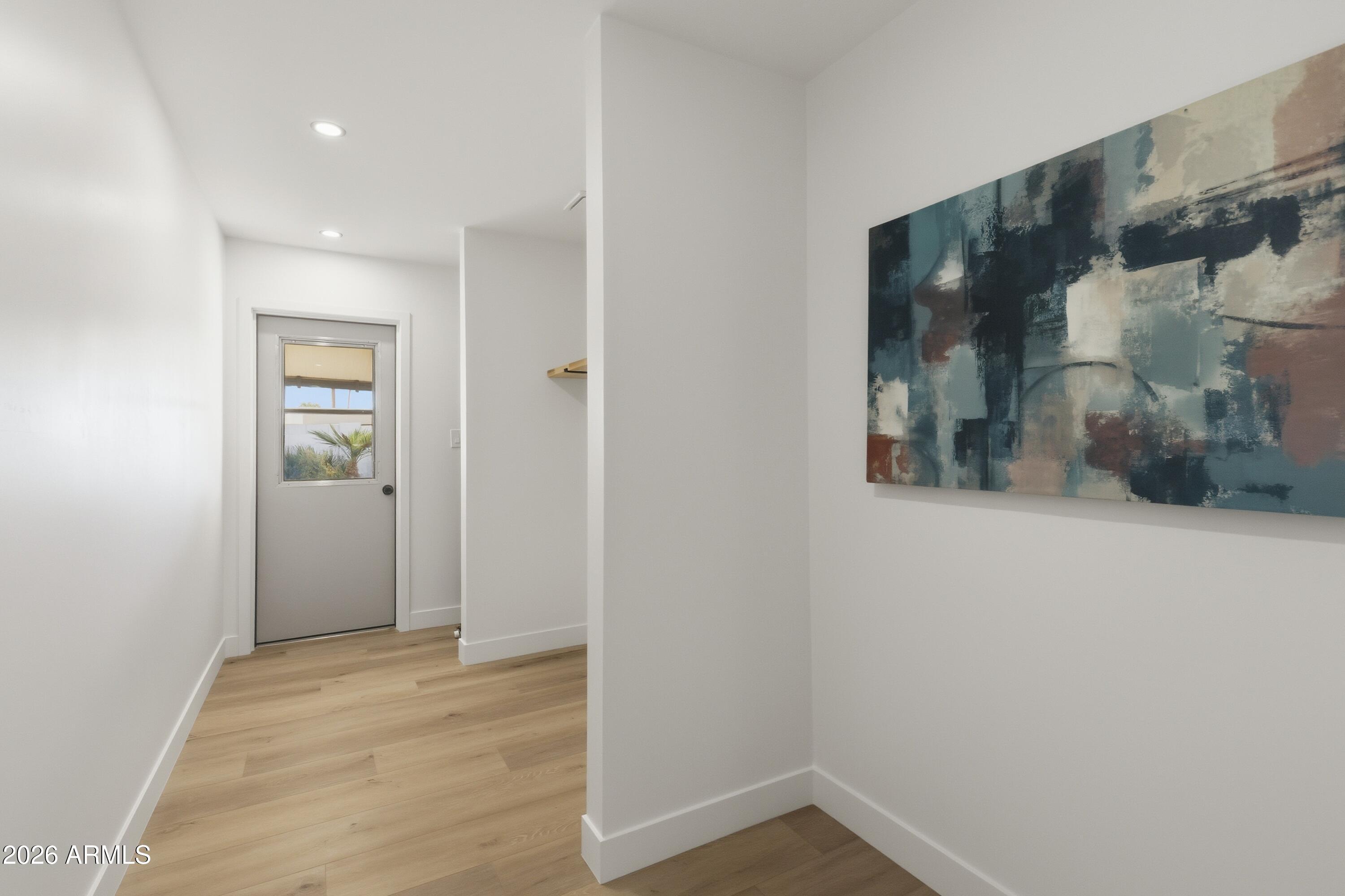 7761 East Chaparral Road Scottsdale, AZ 85250 - Photo 19 of 36 a view of hallway with wooden floor