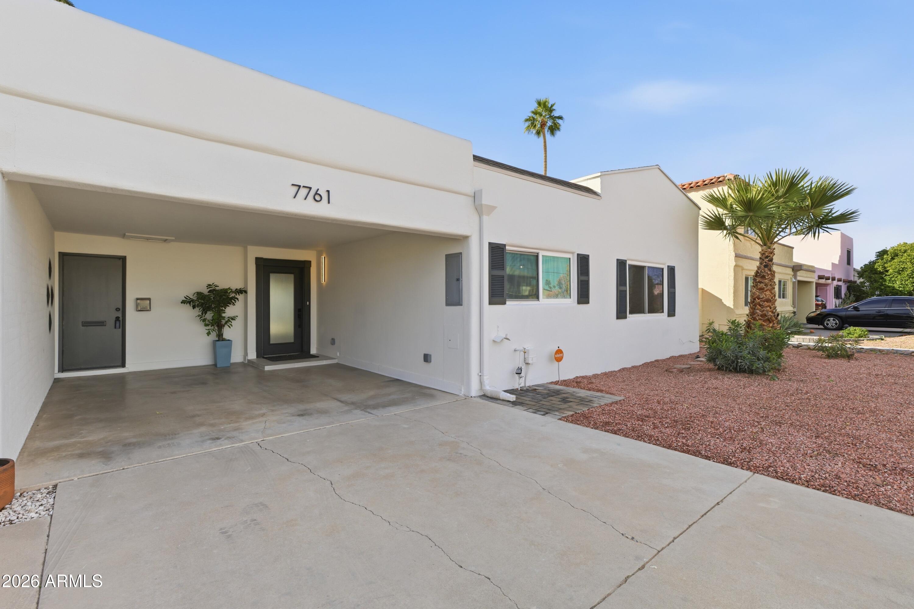 7761 East Chaparral Road Scottsdale, AZ 85250 - Photo 2 of 36 a view of a house with a garage