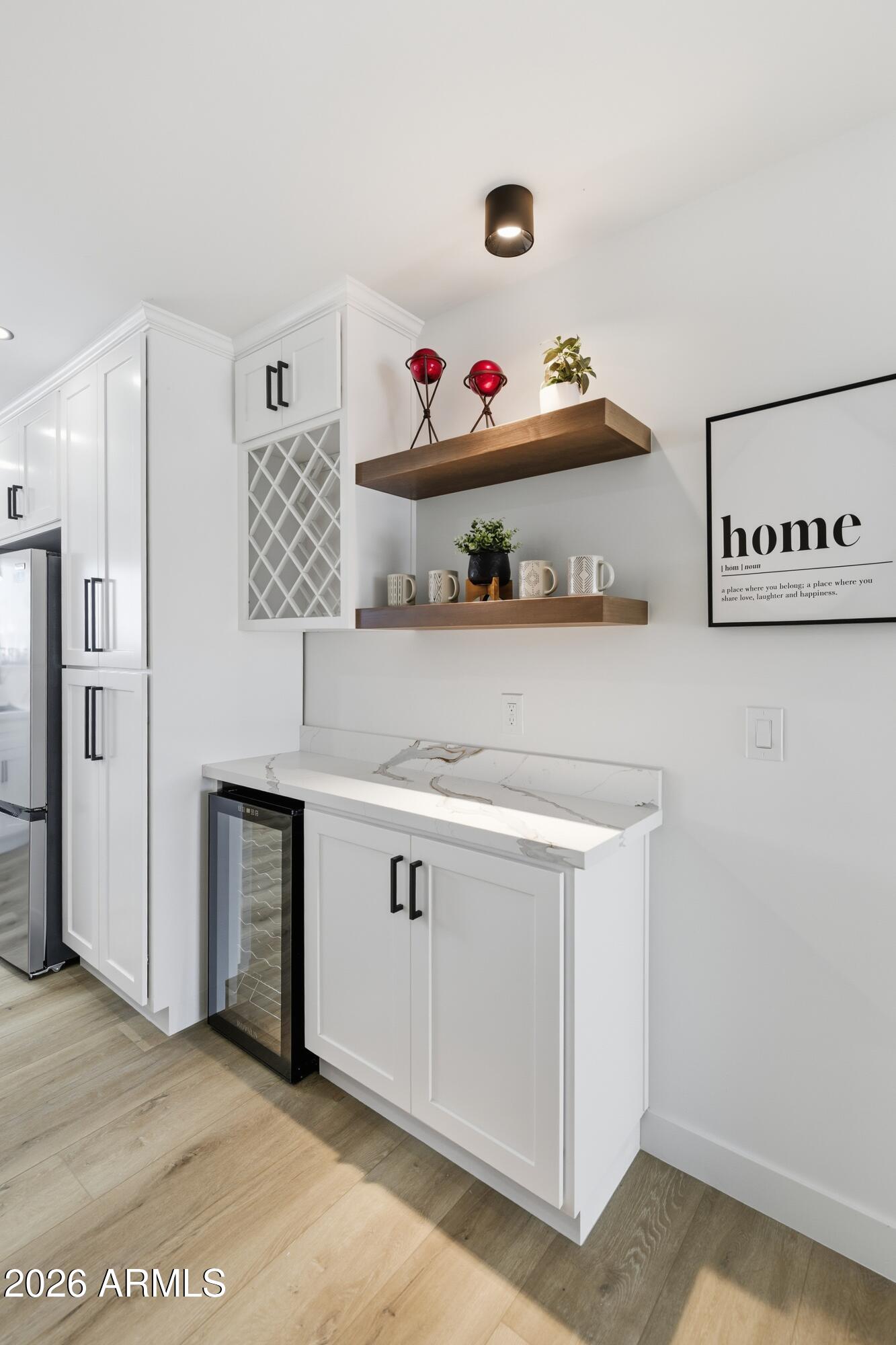 7761 East Chaparral Road Scottsdale, AZ 85250 - Photo 21 of 36 a kitchen with stainless steel appliances granite countertop a white stove top oven and cabinets