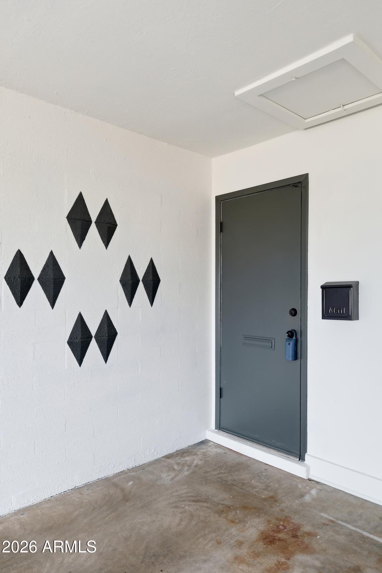7761 East Chaparral Road Scottsdale, AZ 85250 - Photo 30 of 36 an empty room with wooden floor