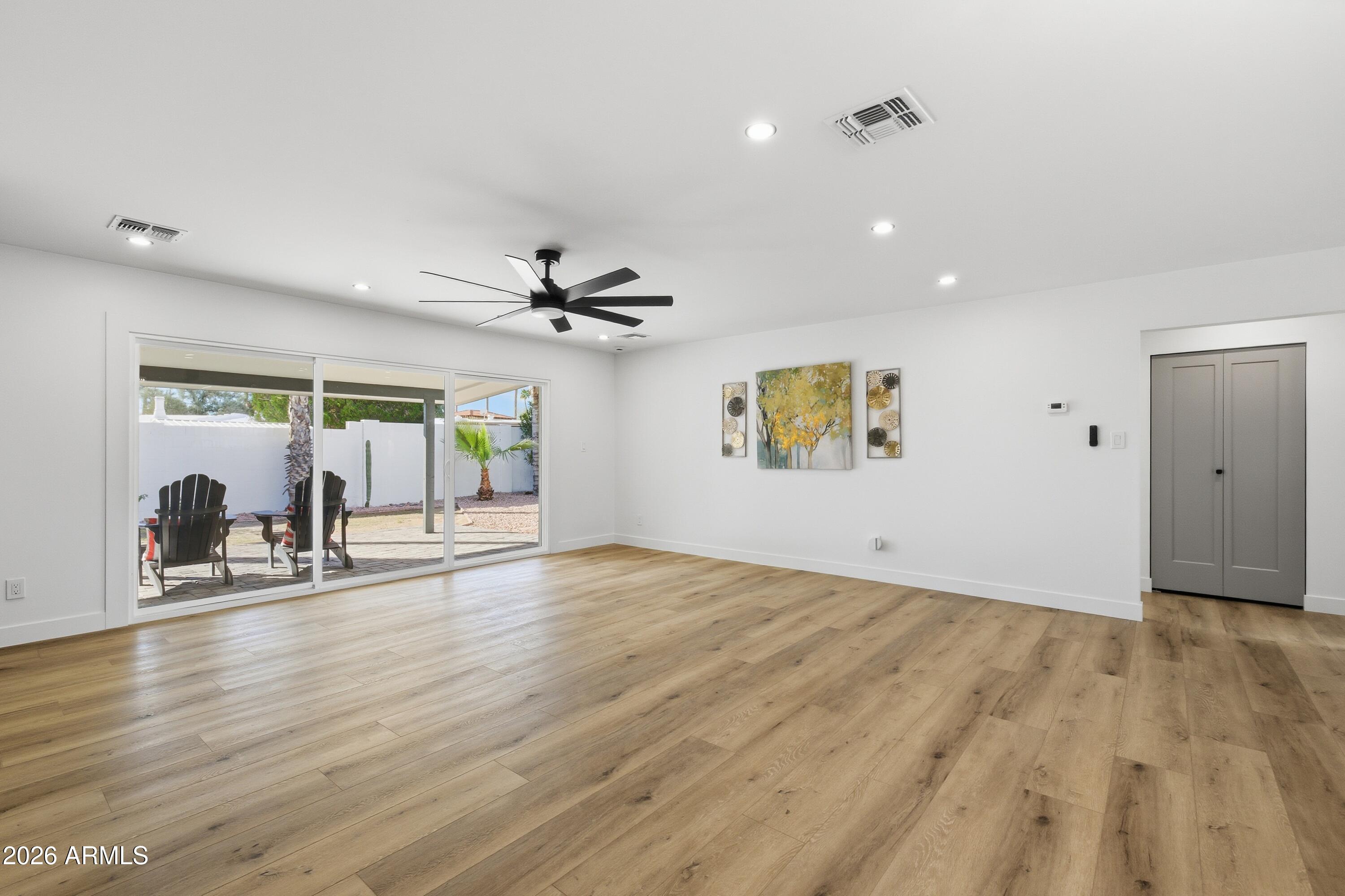 7761 East Chaparral Road Scottsdale, AZ 85250 - Photo 3 of 36 a view of livingroom and hardwood floor