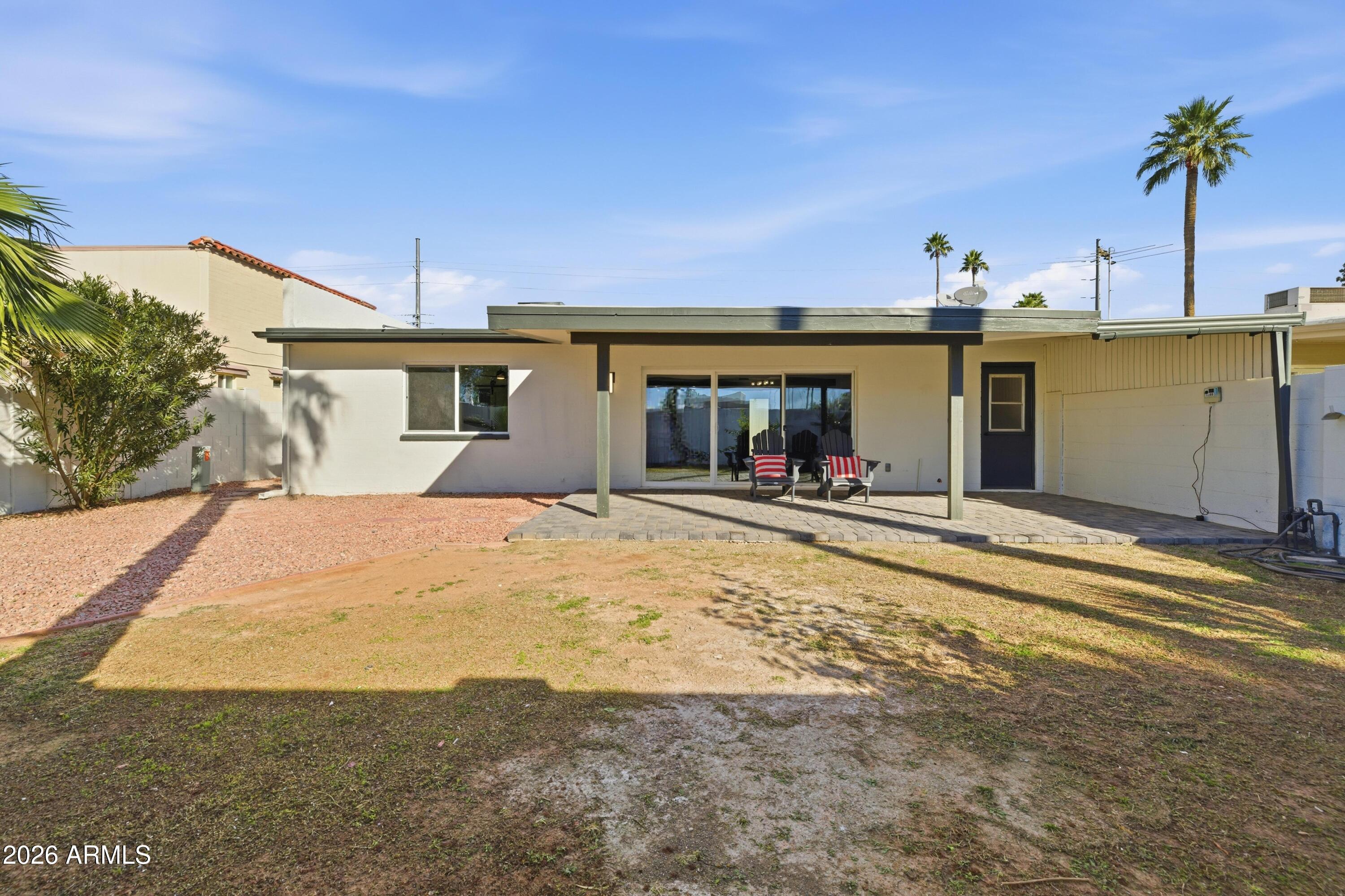 7761 East Chaparral Road Scottsdale, AZ 85250 - Photo 31 of 36 a view of a house with a backyard