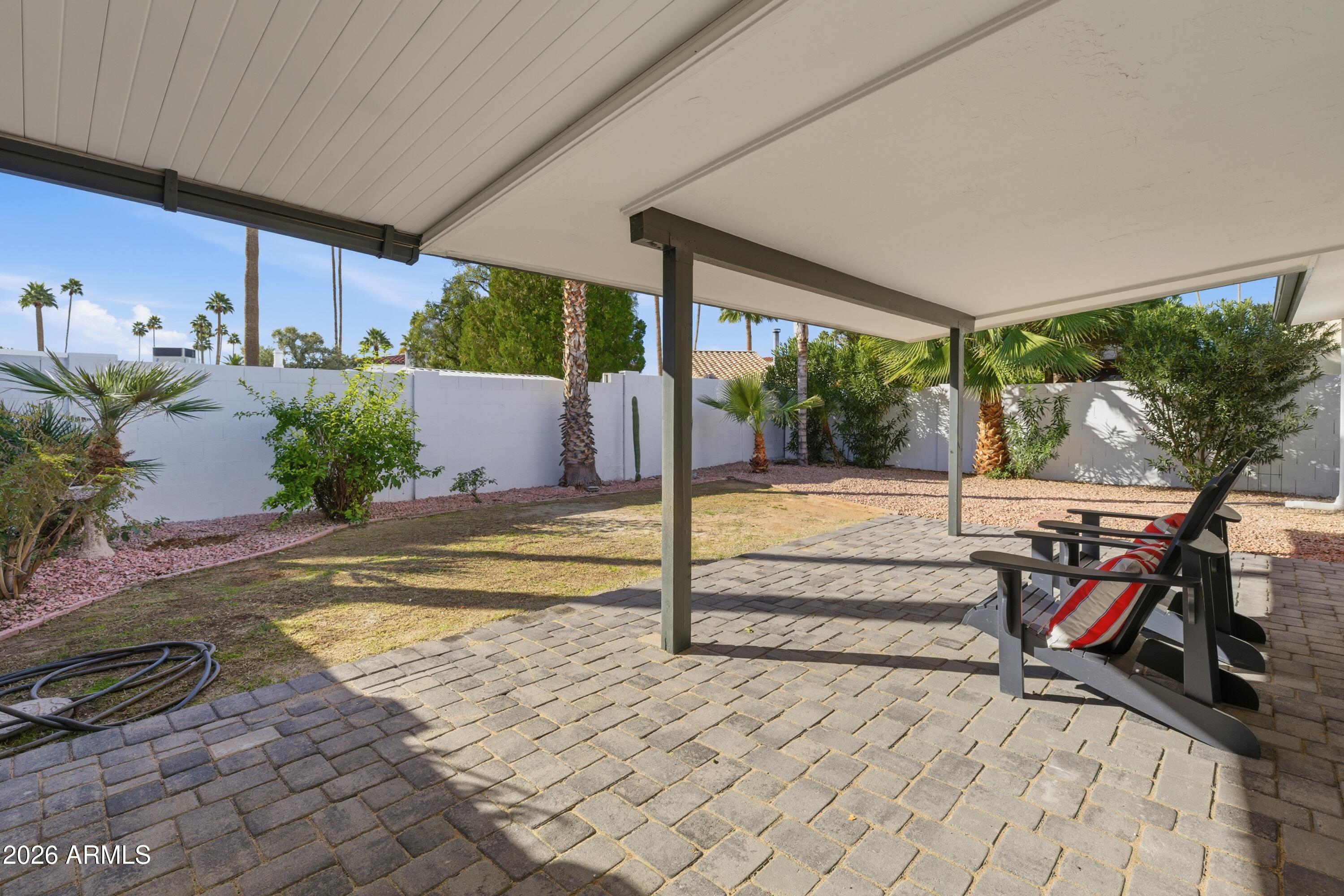 7761 East Chaparral Road Scottsdale, AZ 85250 - Photo 33 of 36 a view of swimming pool with a patio