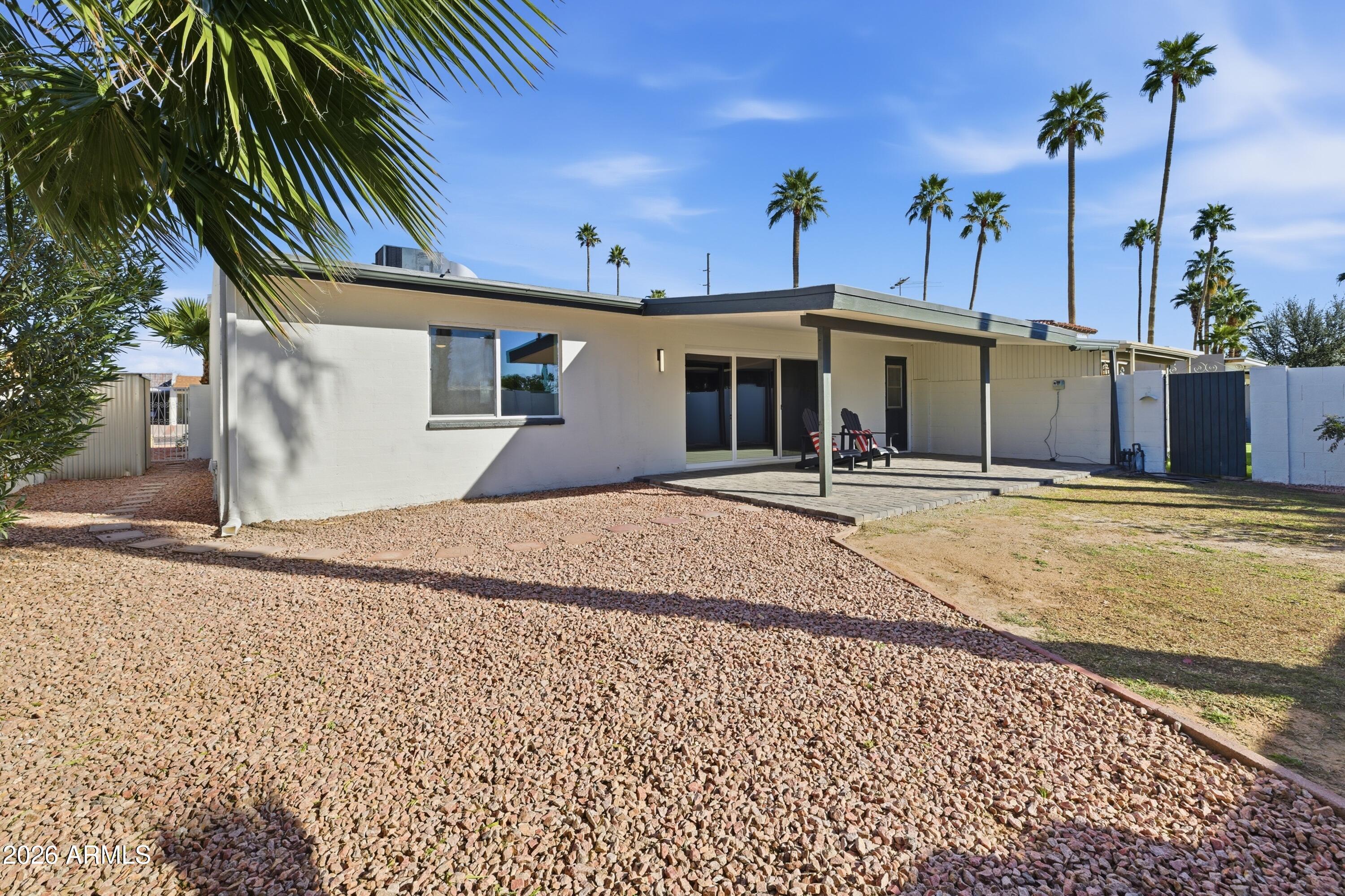 7761 East Chaparral Road Scottsdale, AZ 85250 - Photo 35 of 36 a view of a house with a patio