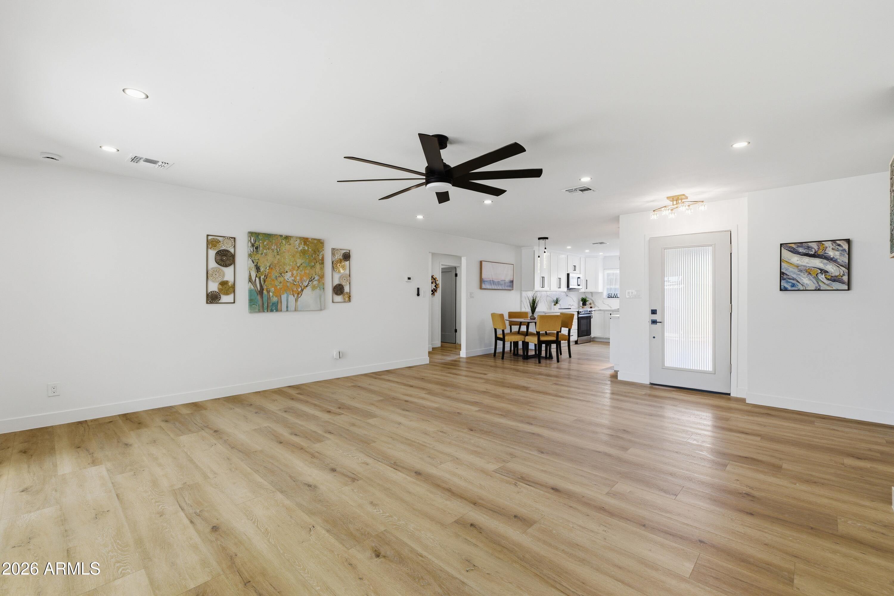 7761 East Chaparral Road Scottsdale, AZ 85250 - Photo 10 of 36 a view of a livingroom with furniture and wooden floor