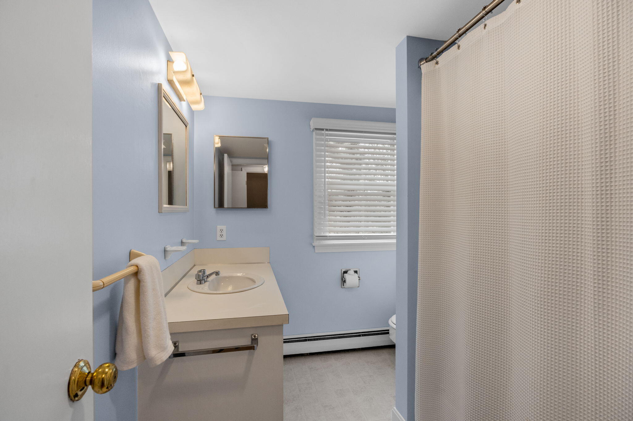 144 Barn Hill Road Chatham, MA 02633 - Photo 17 of 24 a bathroom with a sink a toilet and mirror