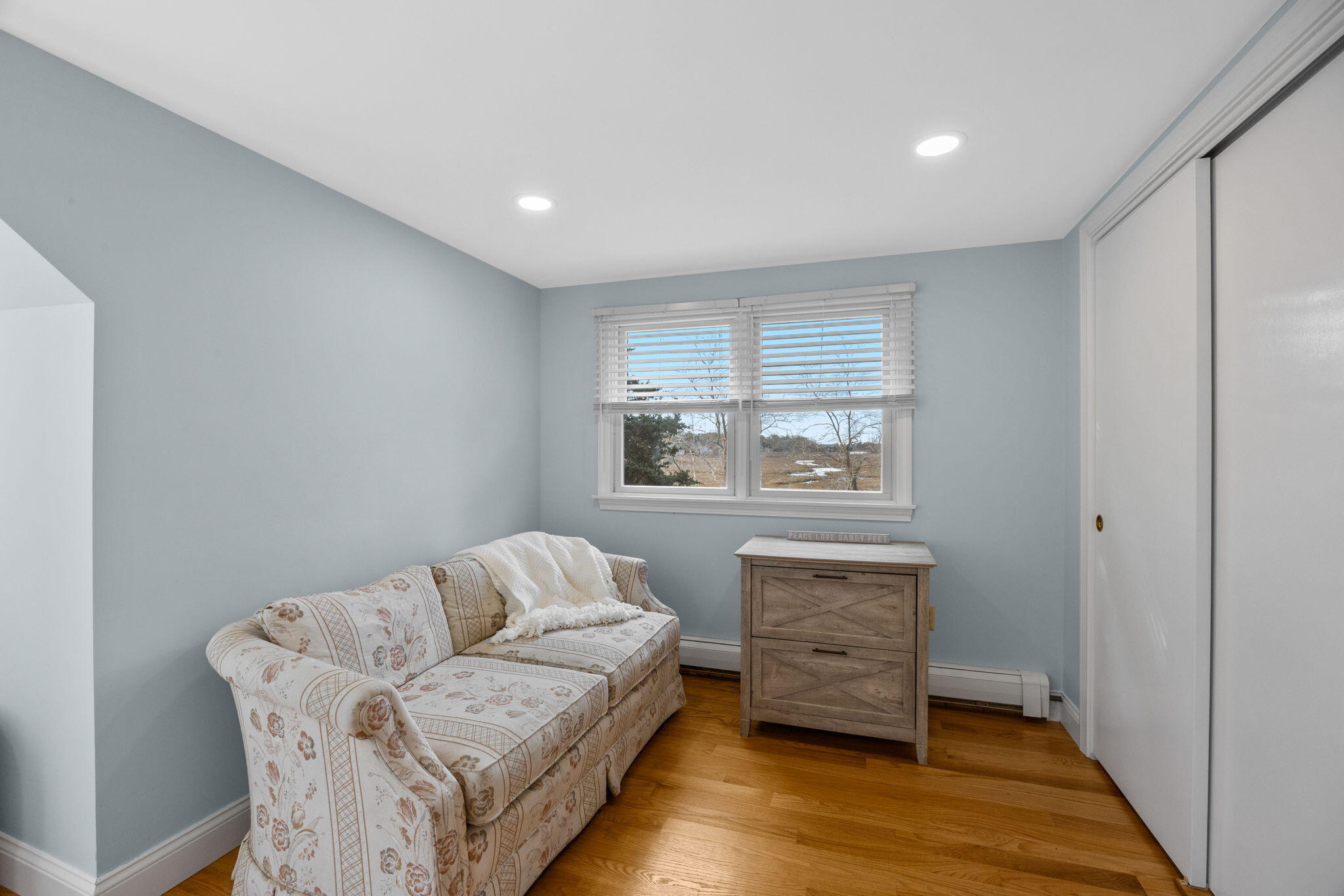 144 Barn Hill Road Chatham, MA 02633 - Photo 19 of 24 a living room with furniture and a wooden floor
