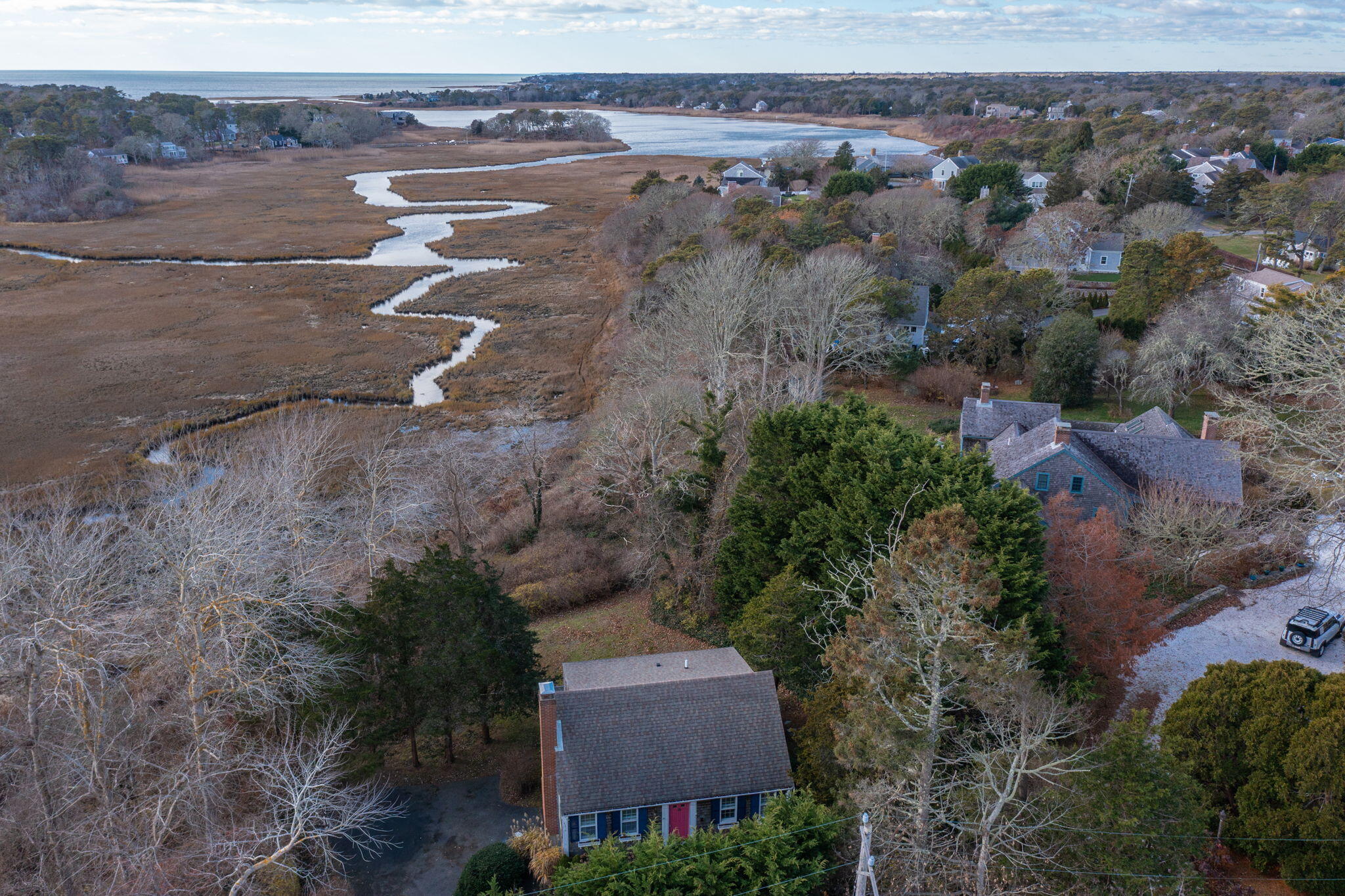 144 Barn Hill Road Chatham, MA 02633 - Photo 2 of 24 an aerial view of a house with a yard