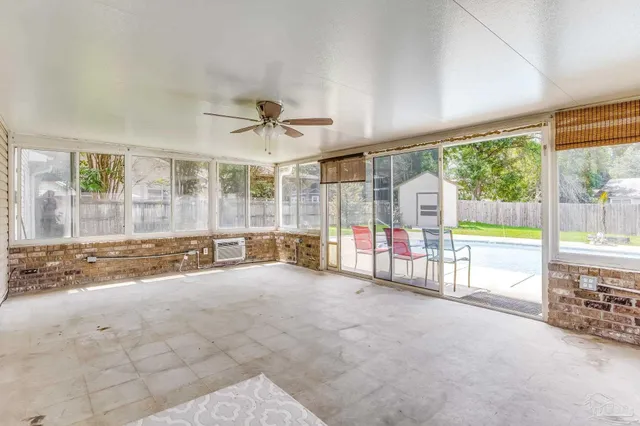 a bathroom with a granite countertop sink a mirror and a bathtub