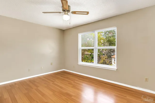 a view of an house with swimming pool and yard