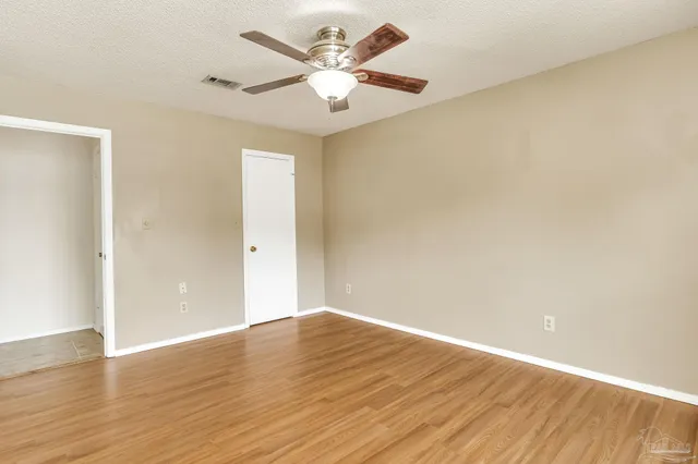 a view of a house with a swimming pool and yard
