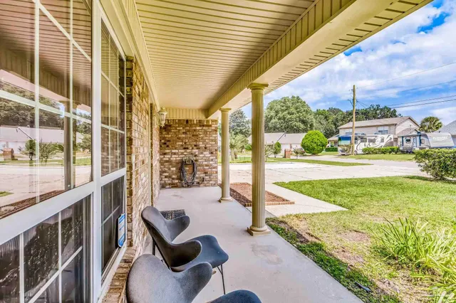 a view of entryway with wooden floor