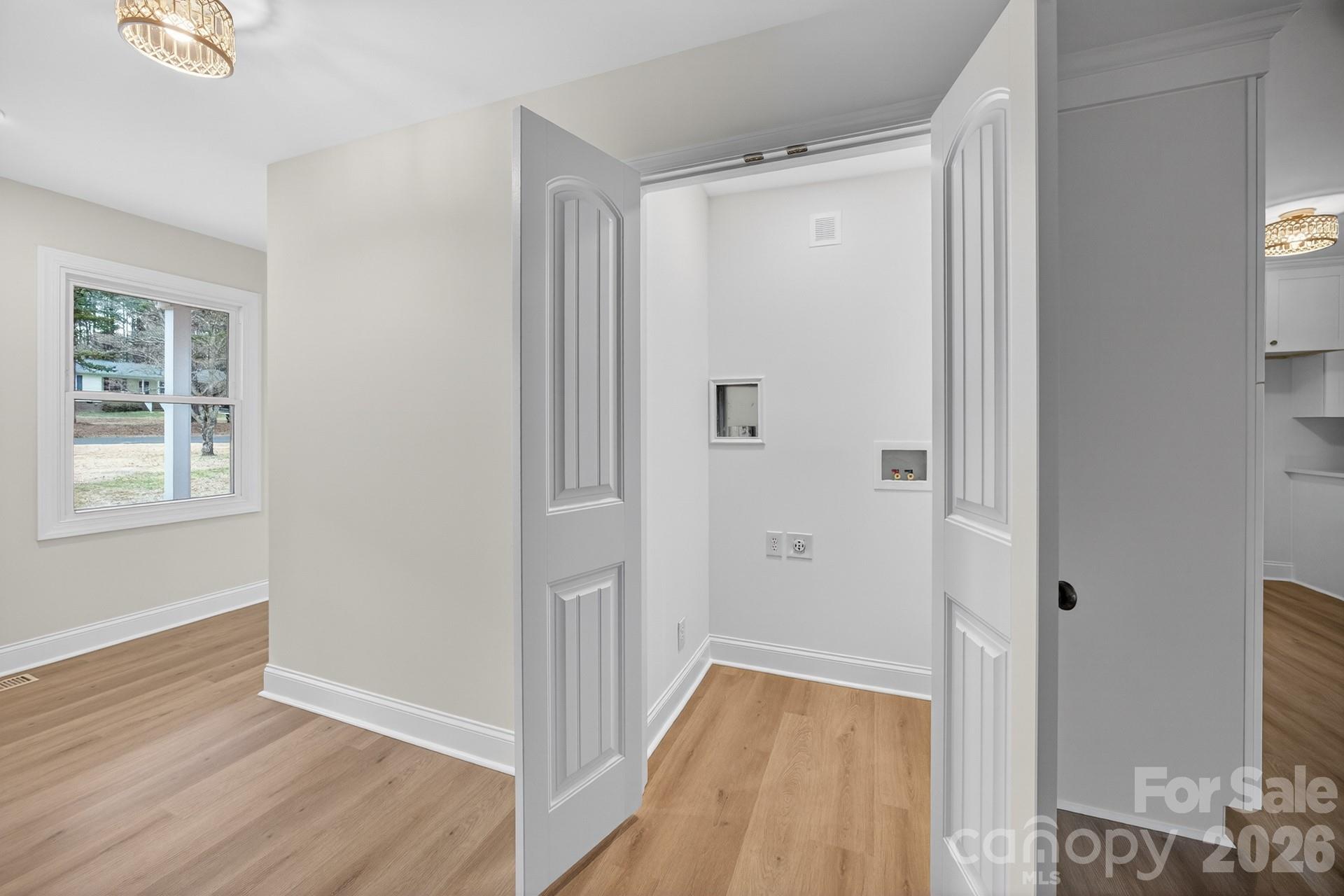 235 Lariat Circle Salisbury, NC 28144 - Photo 11 of 45 a view of a hallway with wooden floor