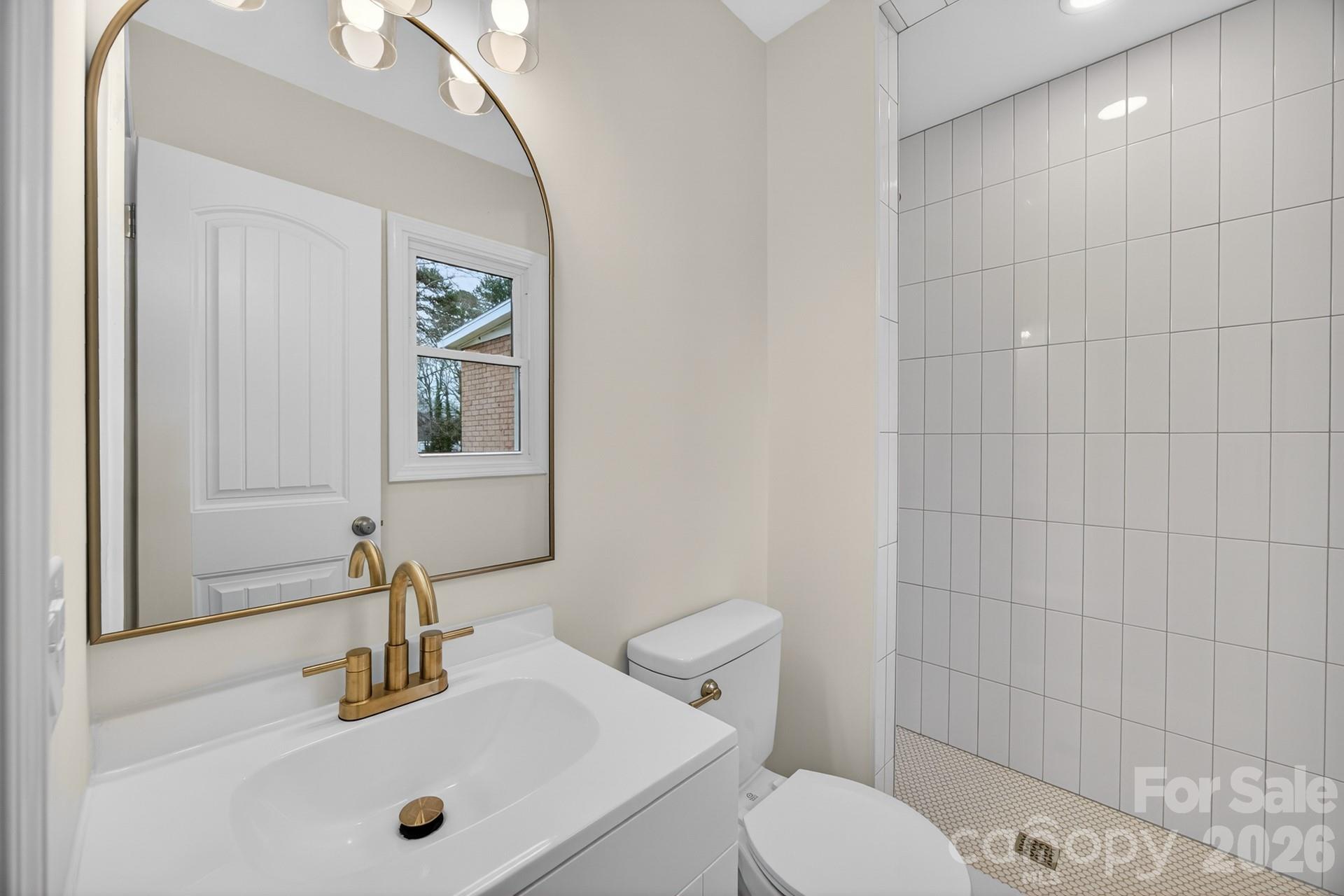 235 Lariat Circle Salisbury, NC 28144 - Photo 14 of 45 a bathroom with a sink a toilet and shower