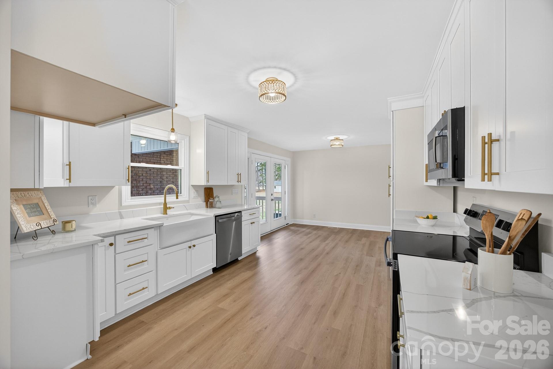 235 Lariat Circle Salisbury, NC 28144 - Photo 16 of 45 a large kitchen with a lot of counter space and wooden floor
