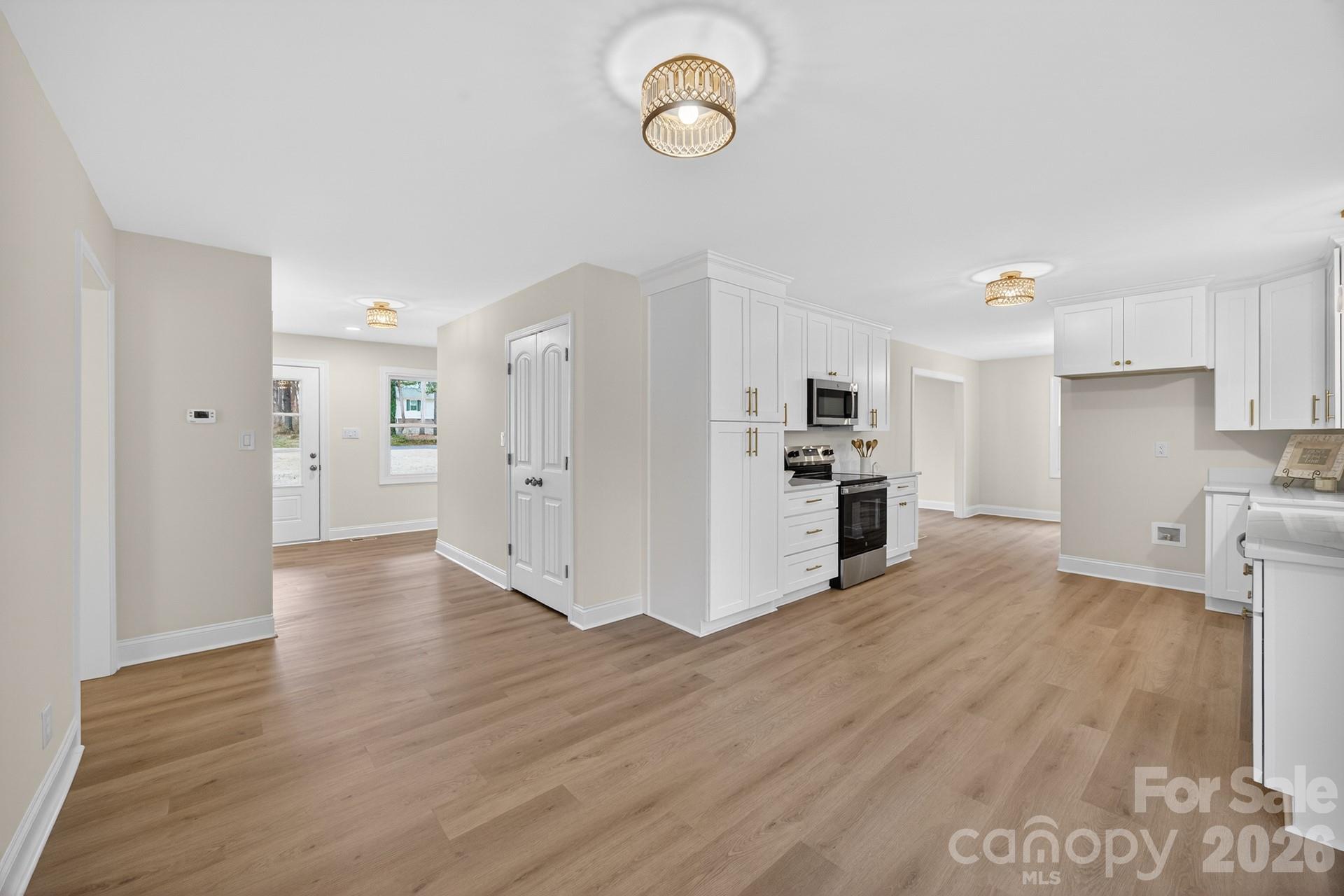 235 Lariat Circle Salisbury, NC 28144 - Photo 22 of 45 a view of a kitchen with refrigerator and wooden floor