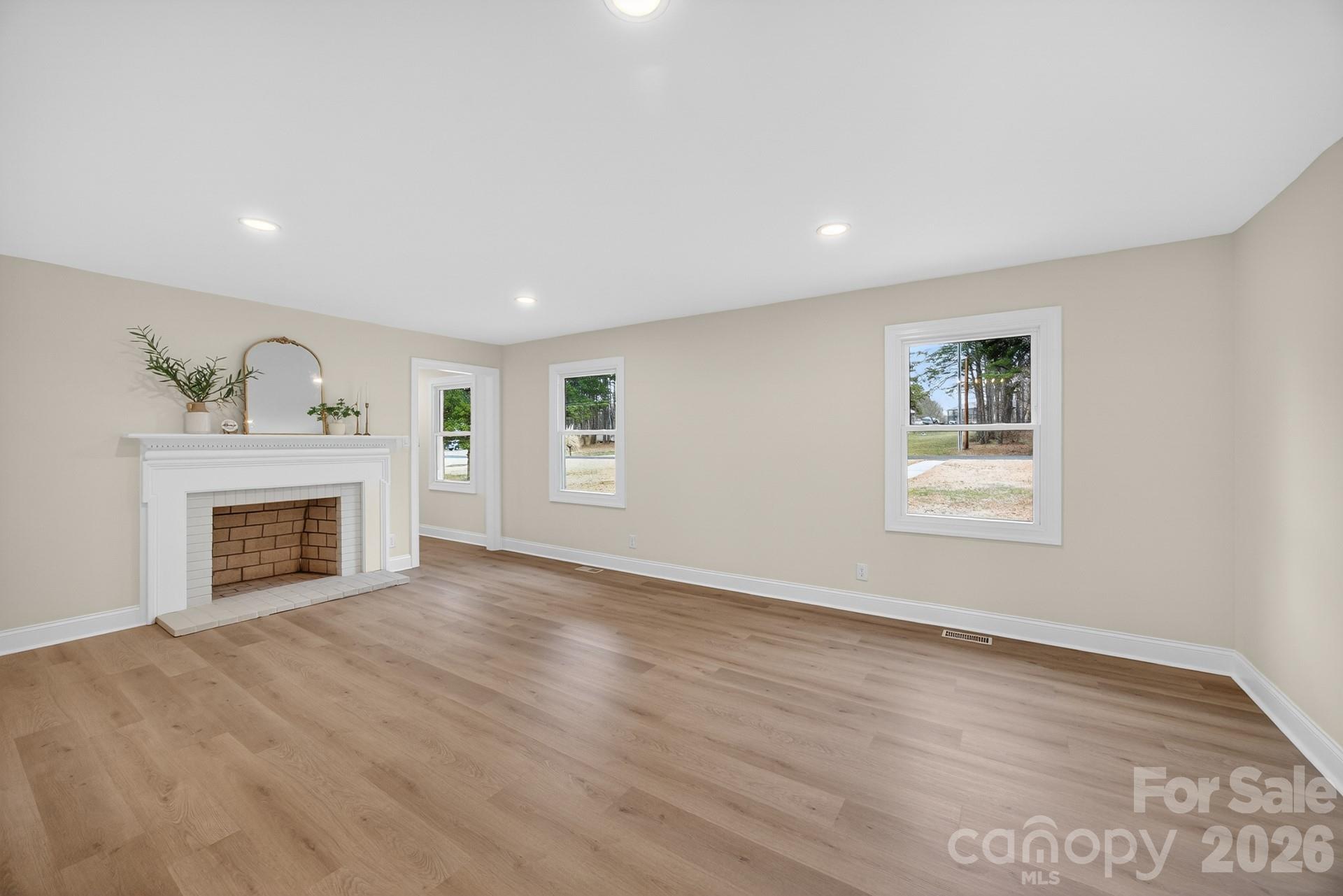 235 Lariat Circle Salisbury, NC 28144 - Photo 24 of 45 a view of an empty room with a fireplace and a window