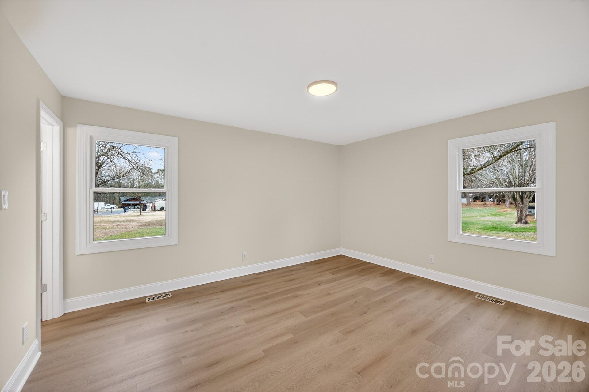 235 Lariat Circle Salisbury, NC 28144 - Photo 26 of 45 a view of an empty room with window and wooden floor