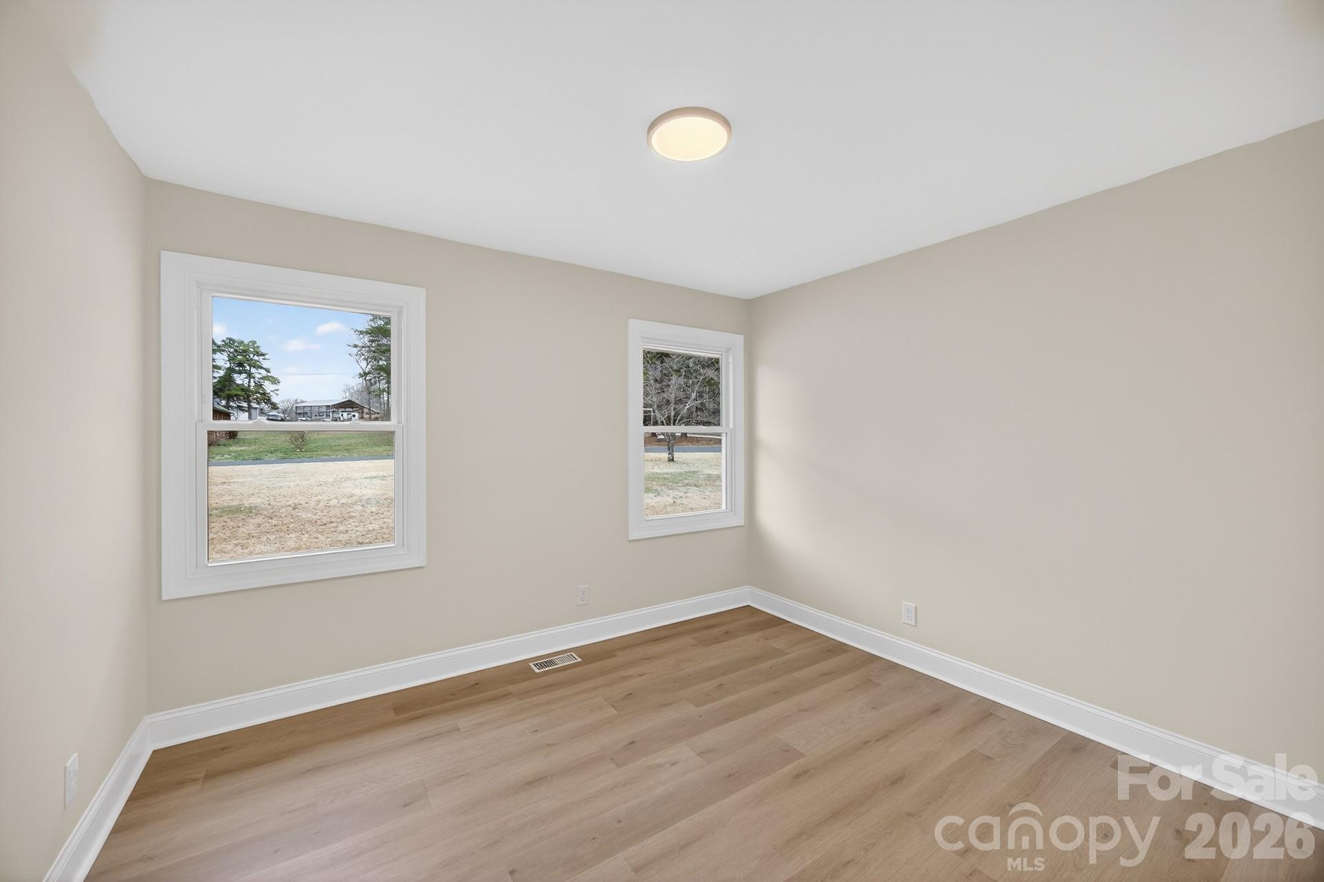 235 Lariat Circle Salisbury, NC 28144 - Photo 28 of 45 an empty room with wooden floor and window