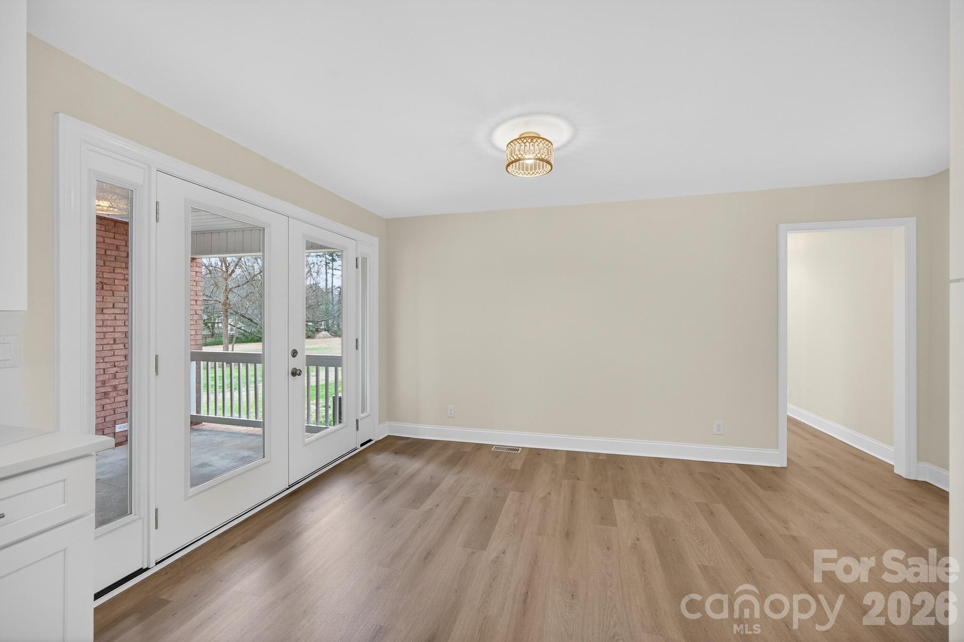 235 Lariat Circle Salisbury, NC 28144 - Photo 29 of 45 an empty room with wooden floor and windows