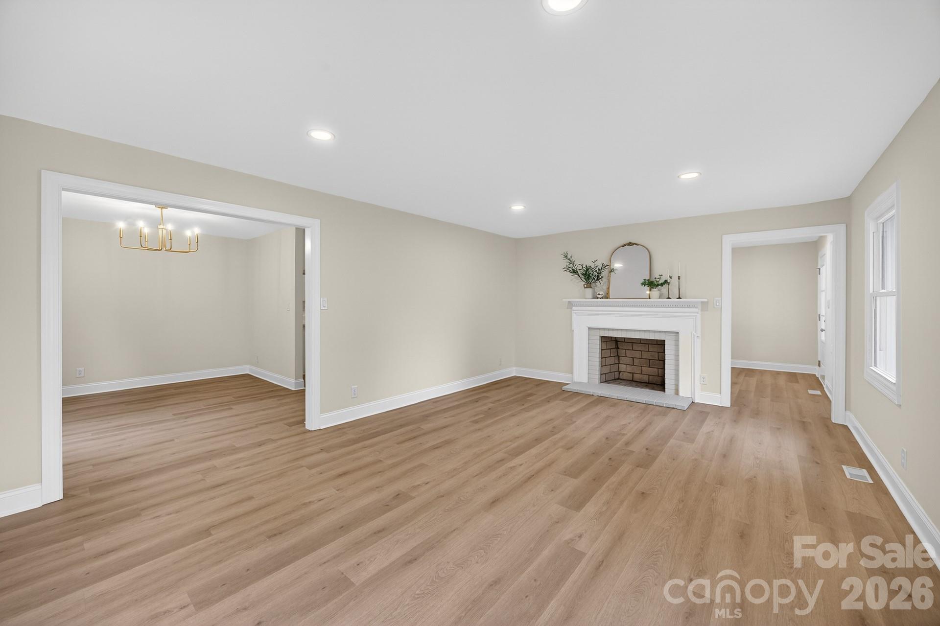235 Lariat Circle Salisbury, NC 28144 - Photo 32 of 45 a view of empty room with wooden floor and fireplace