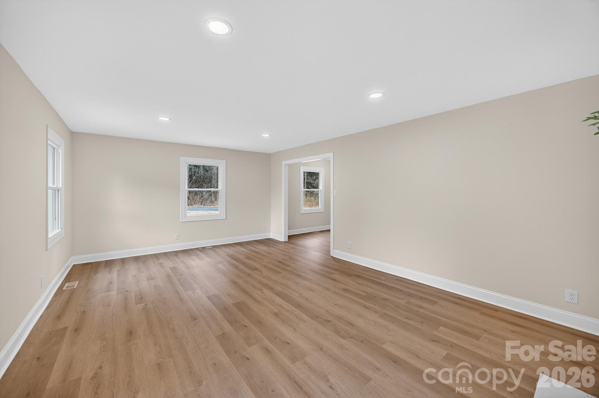 235 Lariat Circle Salisbury, NC 28144 - Photo 33 of 45 a view of an empty room with wooden floor and a window