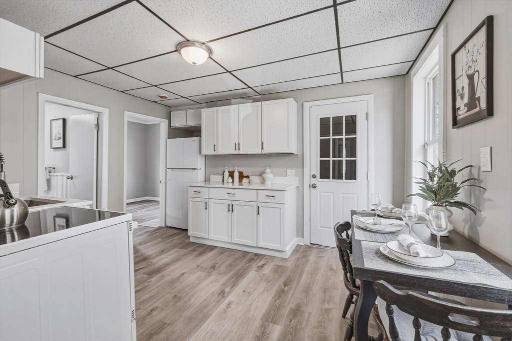 a kitchen with furniture wooden floor cabinets and a counter top space