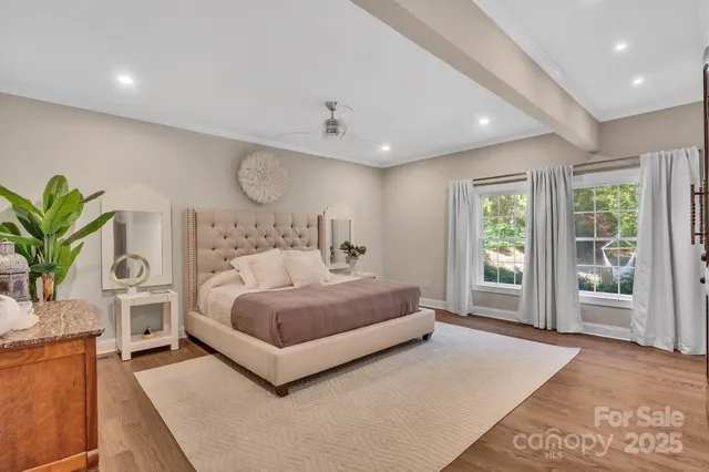 a living room with furniture and a painting on the wall