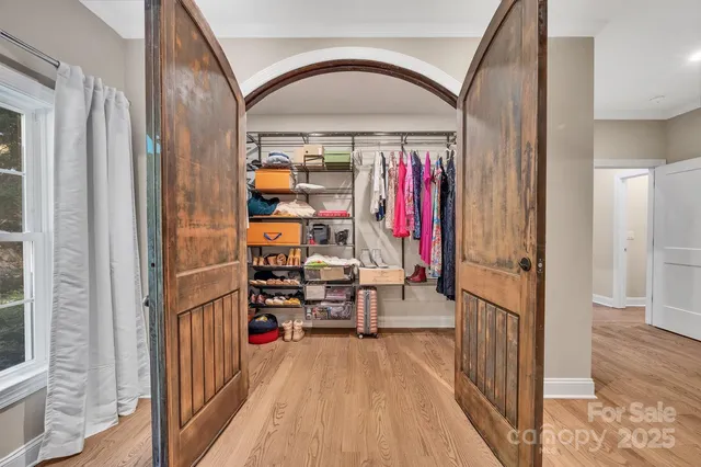 a bathroom with a toilet and a mirror