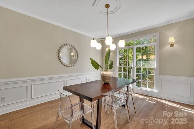 a bathroom with a sink a vanity and a large mirror