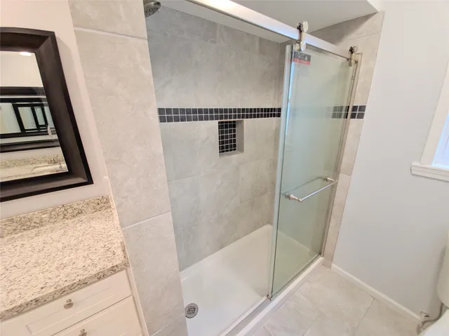 a bathroom with a tub and a shower