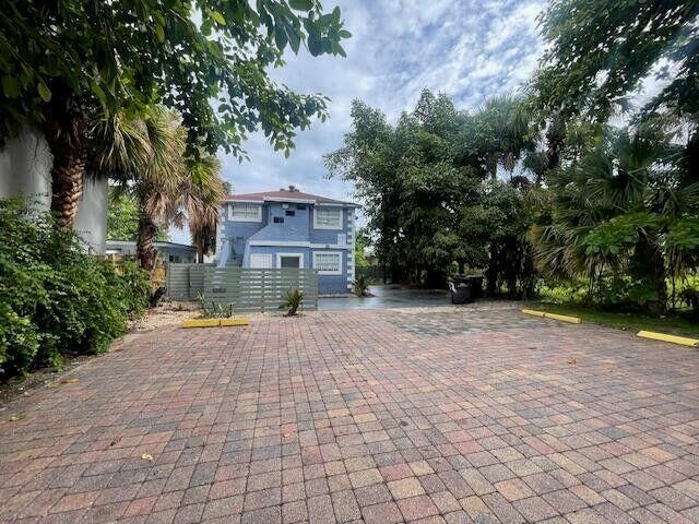 919 2nd Street, Unit 3 West Palm Beach, FL 33401 - Photo 1 of 11 a view of a house with a yard