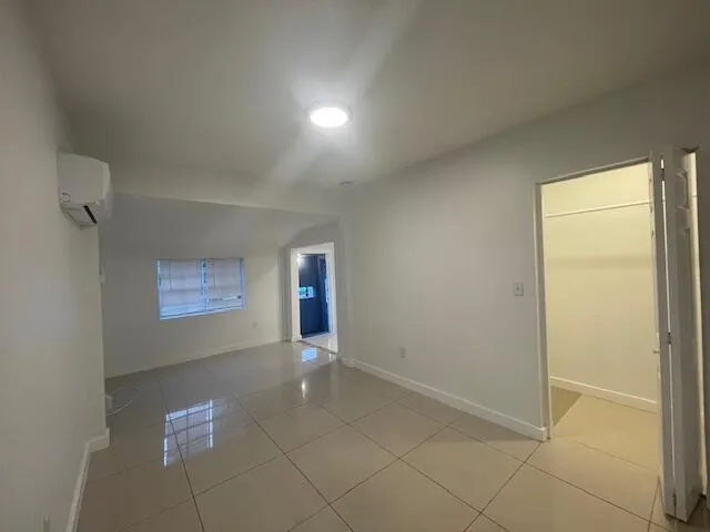 a view of an empty room and window