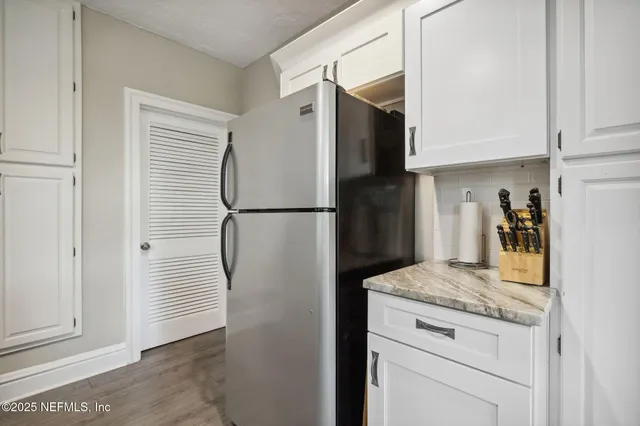 a kitchen that has a stove and a microwave