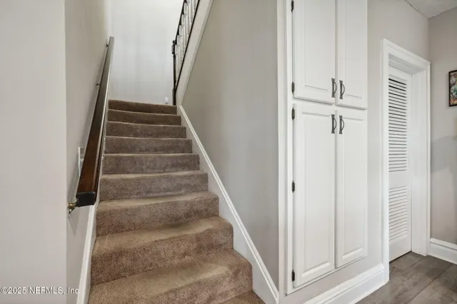 a kitchen with refrigerator and window