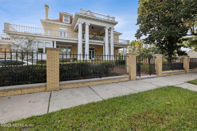 a view of a building with a yard