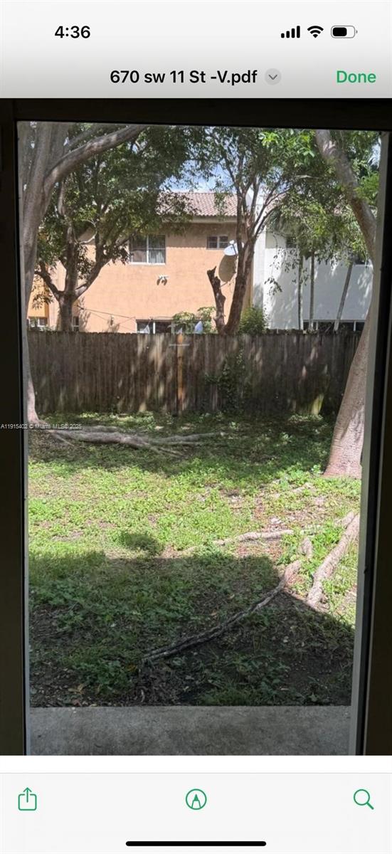 657 Southwest 10th Street, Unit 657 Florida City, FL 33034 - Photo 5 of 12 a view of swimming pool from a yard
