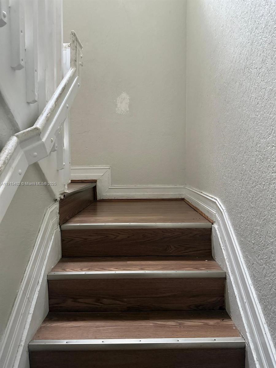 657 Southwest 10th Street, Unit 657 Florida City, FL 33034 - Photo 7 of 12 a close view of staircase