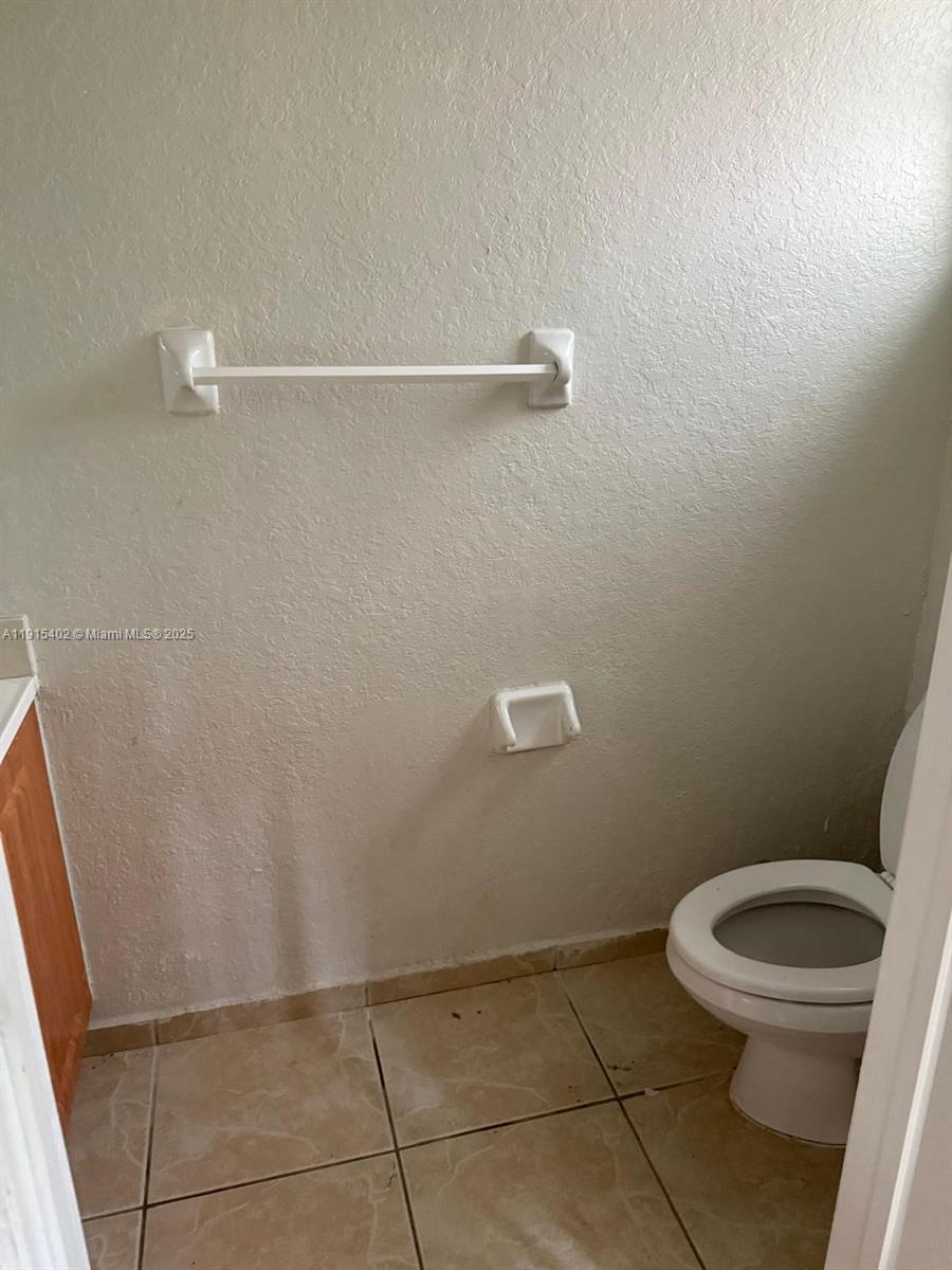 657 Southwest 10th Street, Unit 657 Florida City, FL 33034 - Photo 8 of 12 a bathroom with a toilet