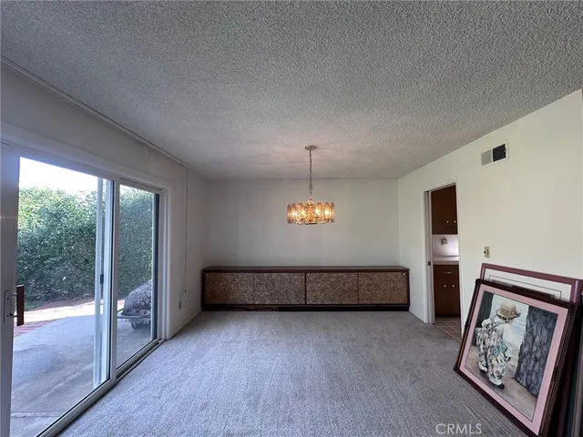 a view of room with window and wooden floor